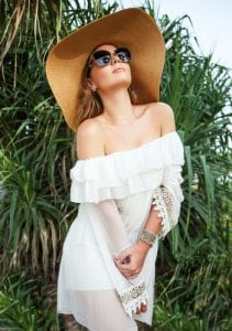 Summer fashion portrait of pretty young girl on the beach